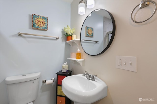 bathroom with sink and toilet