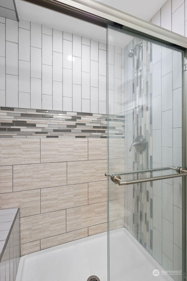 bathroom with an enclosed shower