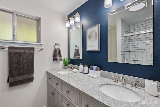 bathroom featuring vanity and a shower with shower door