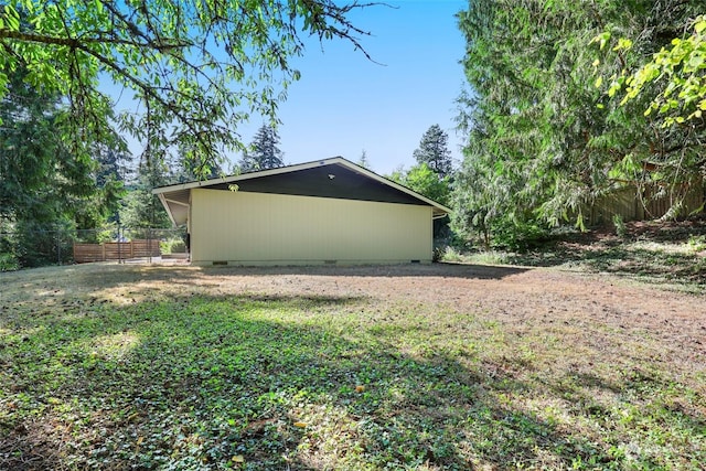 view of side of home with a lawn