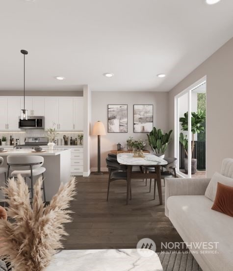 dining area with dark hardwood / wood-style floors