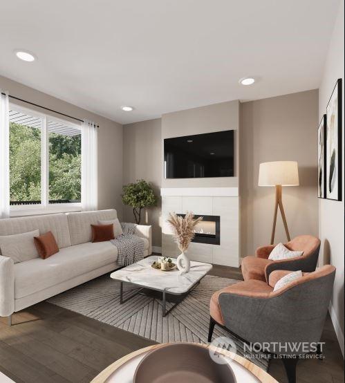 living room featuring dark hardwood / wood-style floors and a fireplace