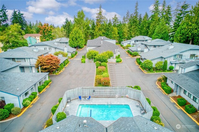 birds eye view of property with a residential view