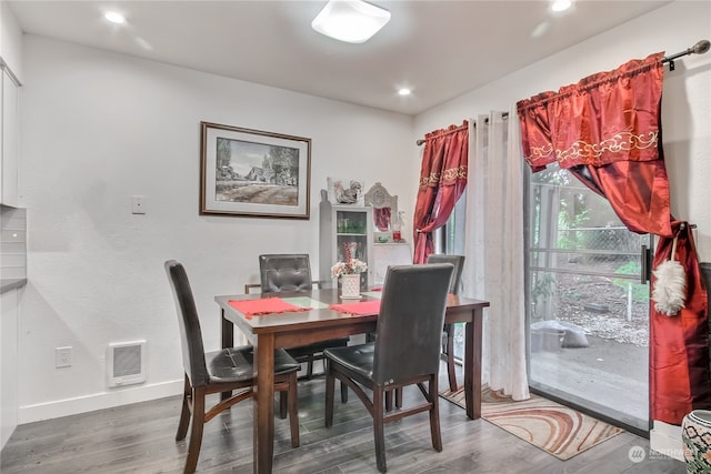 dining space with recessed lighting, wood finished floors, visible vents, and baseboards