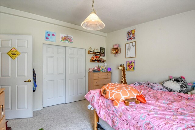 carpeted bedroom featuring a closet