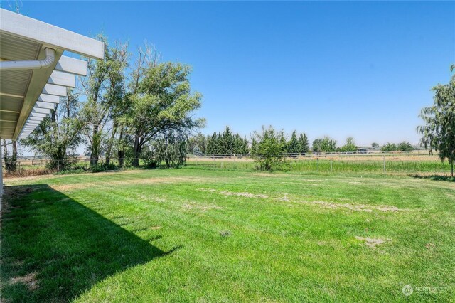 view of yard with a rural view