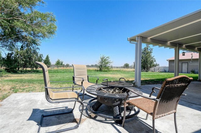 view of patio / terrace featuring an outdoor fire pit