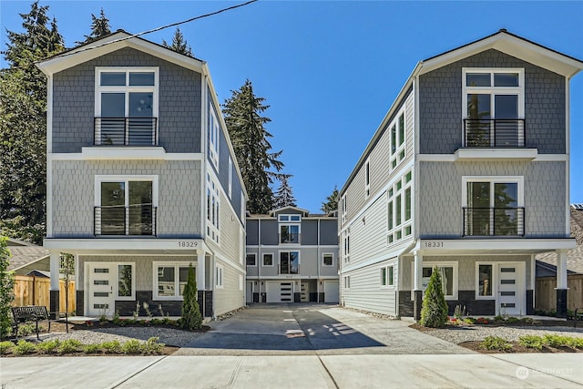 view of front of house with a balcony