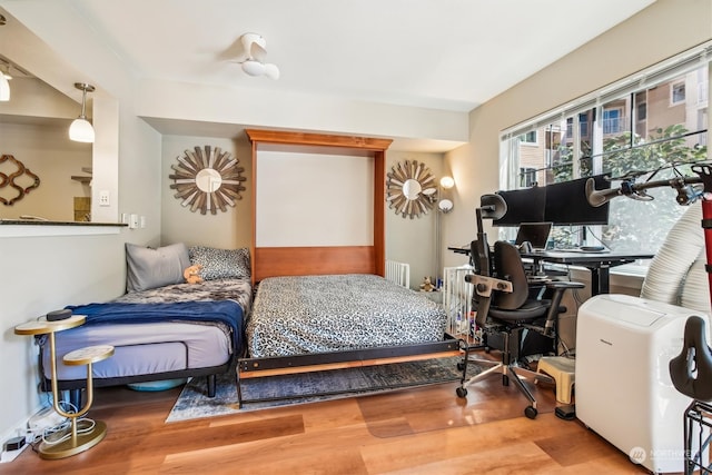 bedroom featuring hardwood / wood-style flooring