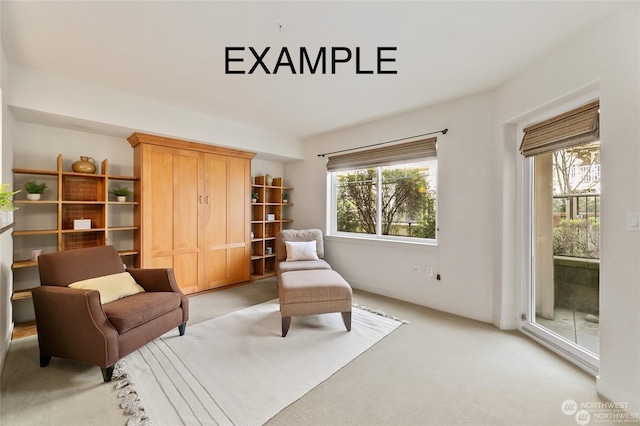 sitting room featuring light colored carpet