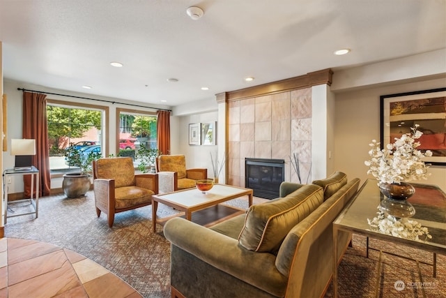 living room with tile patterned floors, a fireplace, and tile walls