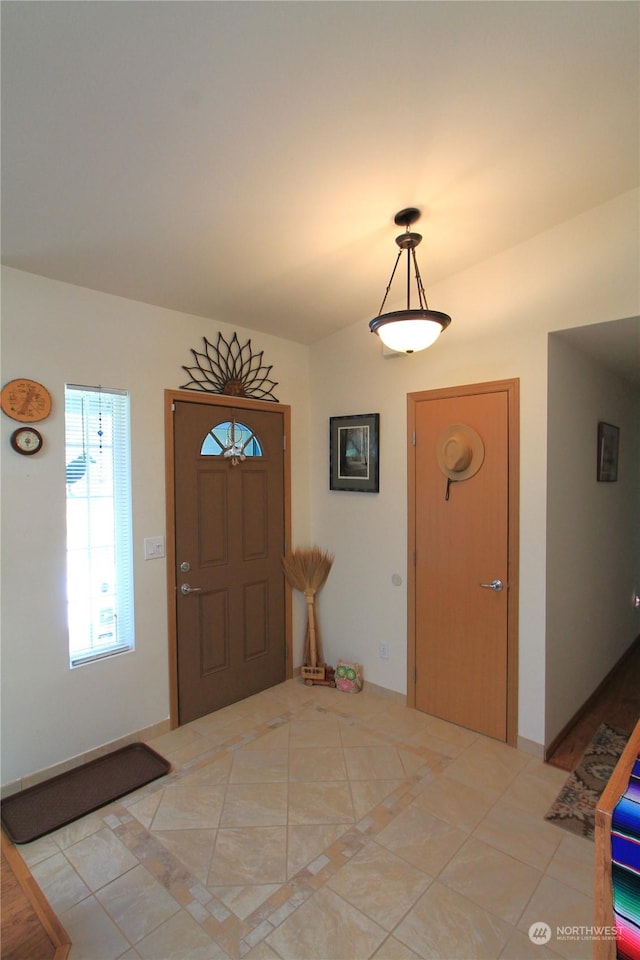 entrance foyer with light tile patterned floors