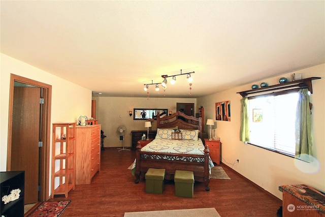 bedroom with dark wood-style floors