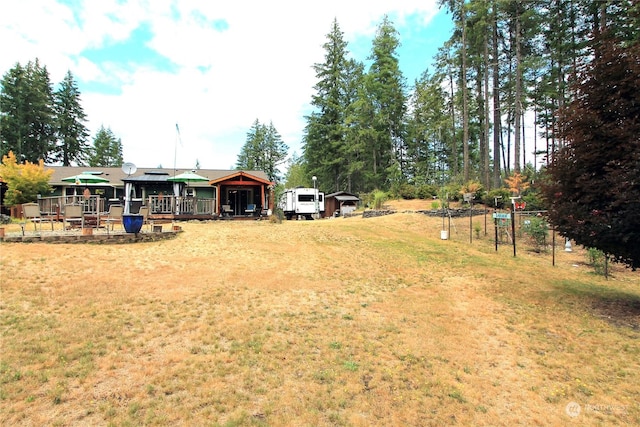 view of yard featuring driveway and a gazebo