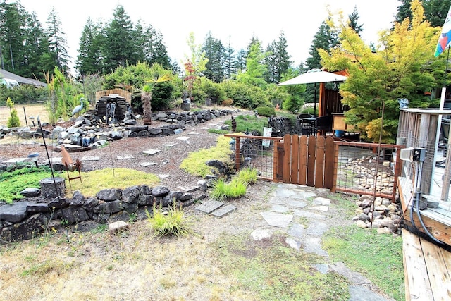 view of yard with fence and a gate