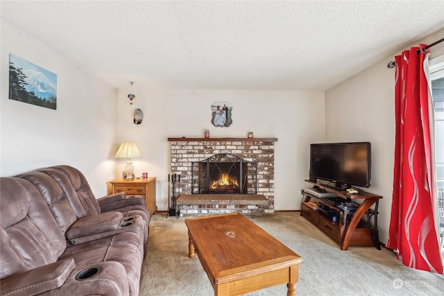 carpeted living area featuring a brick fireplace and a textured ceiling