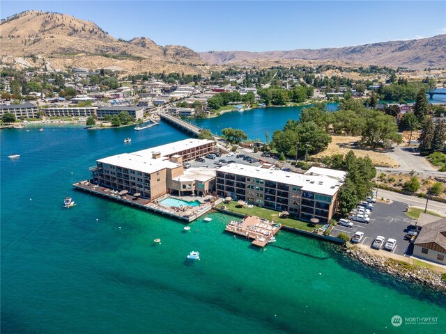 bird's eye view with a water and mountain view