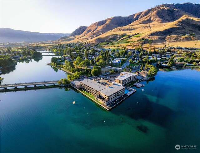 drone / aerial view with a water and mountain view