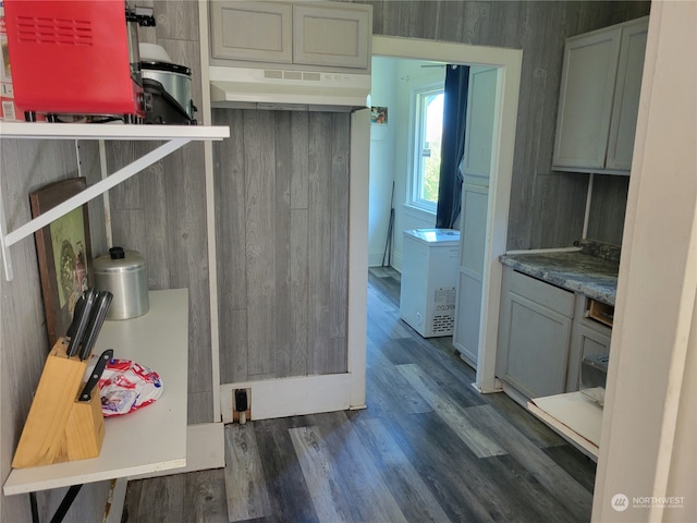 kitchen with gray cabinetry and dark hardwood / wood-style flooring