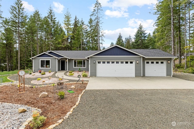 single story home featuring driveway, an attached garage, and roof with shingles