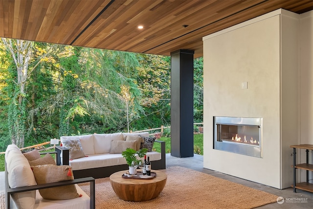 view of patio / terrace featuring an outdoor fireplace