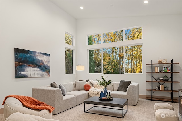 living room with high vaulted ceiling