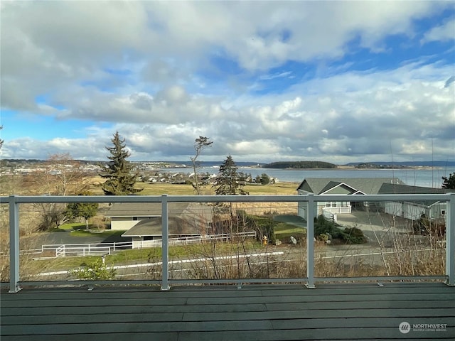 wooden terrace with a water view