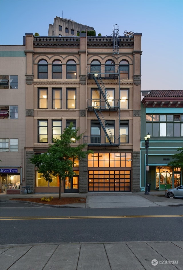 view of outdoor building at dusk