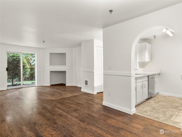 unfurnished living room featuring light wood-type flooring