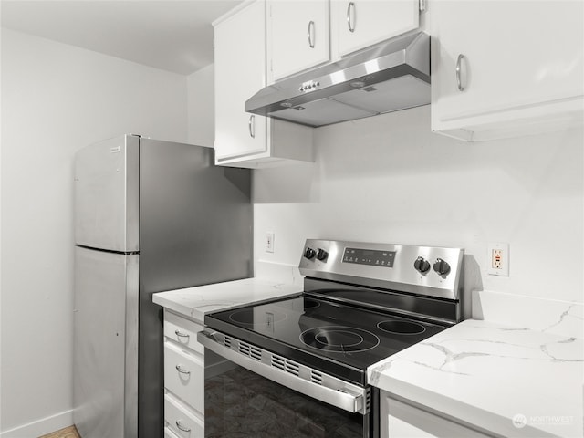 kitchen featuring stainless steel electric stove, white cabinets, and light stone countertops