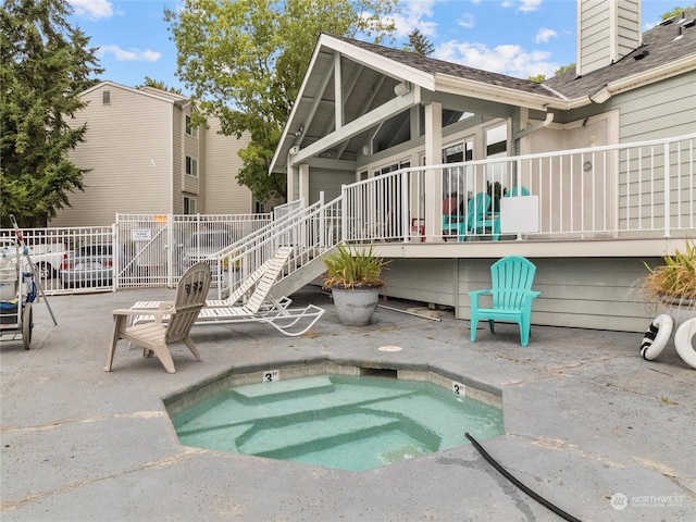 view of swimming pool with a patio area