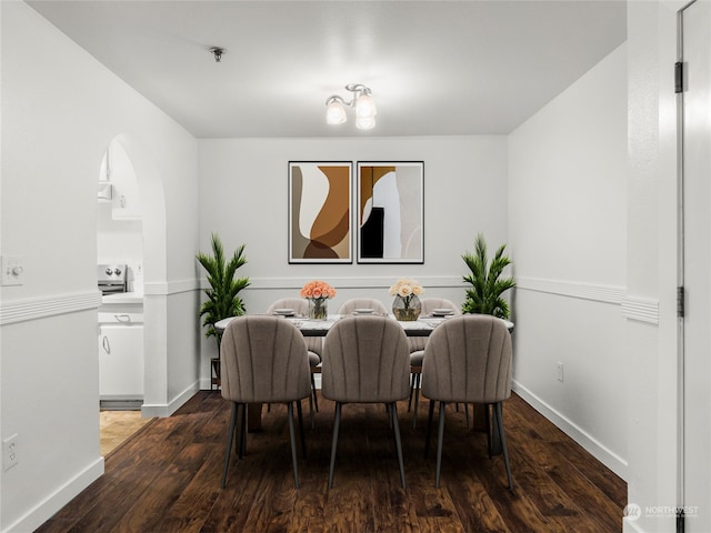 dining area with dark hardwood / wood-style floors