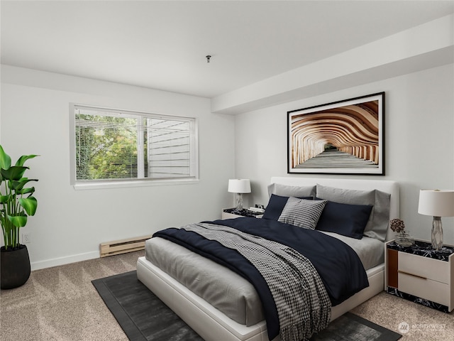 carpeted bedroom with a baseboard heating unit