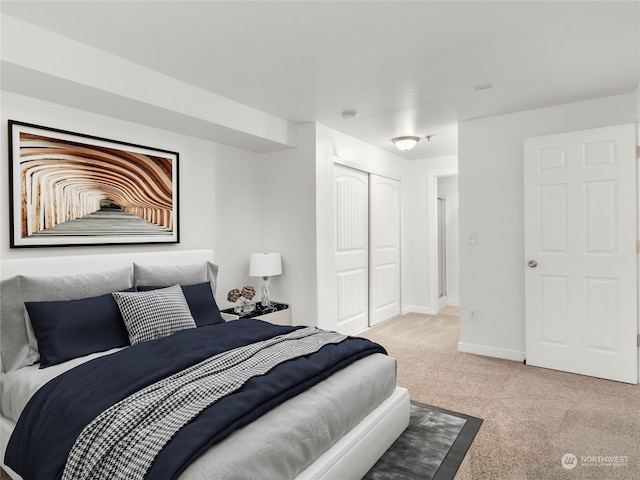 carpeted bedroom with a closet