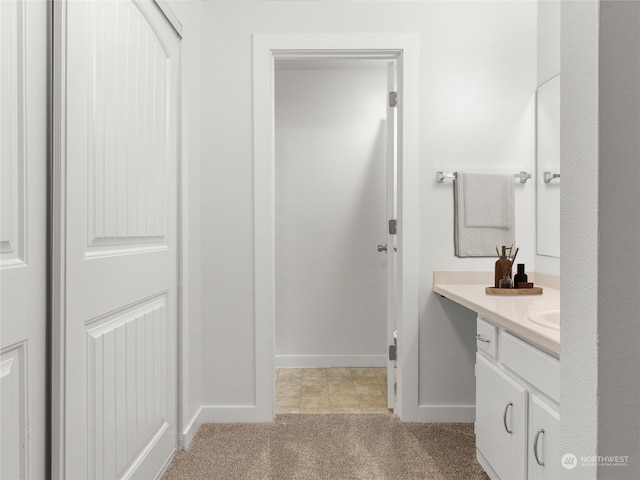 bathroom featuring tile patterned flooring and vanity