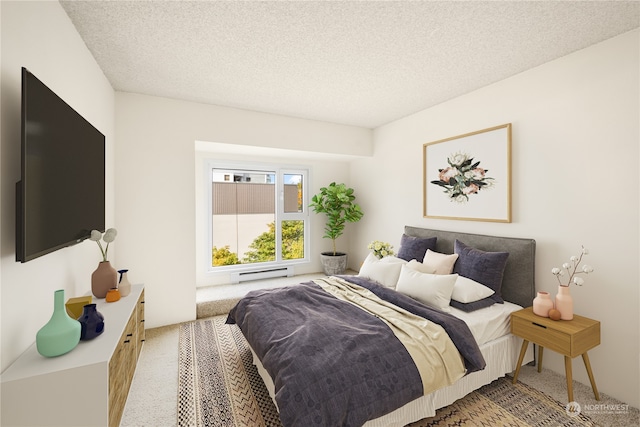 bedroom with a baseboard heating unit, a textured ceiling, and carpet