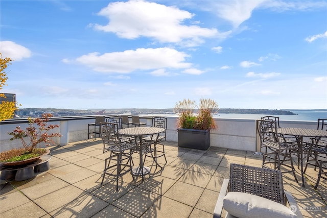 view of patio / terrace featuring a water view