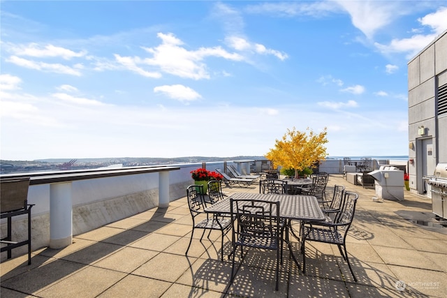 view of patio with a water view