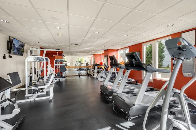 gym featuring a paneled ceiling