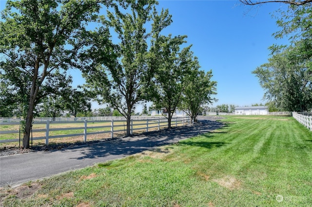 view of yard with a rural view