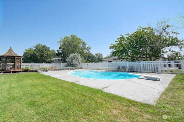 view of pool with a gazebo and a lawn