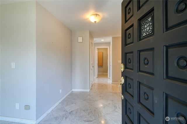 entryway with light tile patterned floors