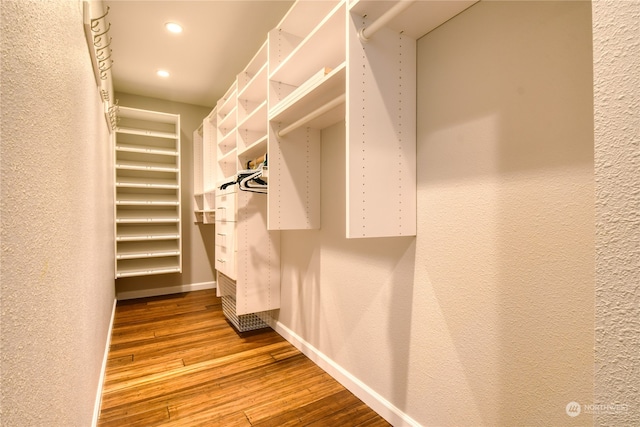 spacious closet featuring light hardwood / wood-style flooring