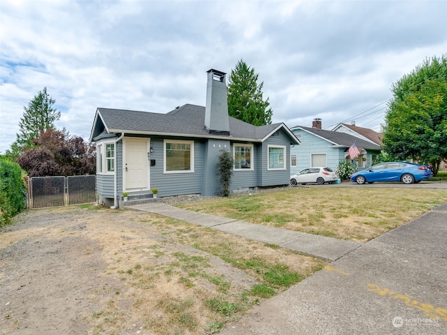 ranch-style house with a front lawn