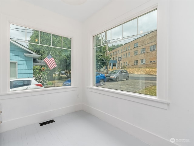 spare room with tile patterned flooring and plenty of natural light