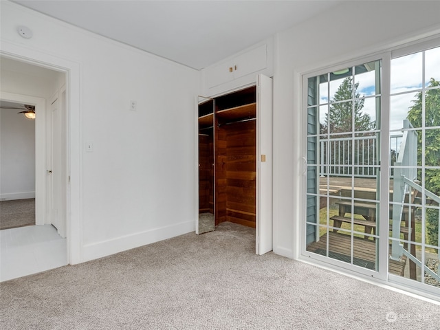 unfurnished bedroom with a closet and carpet