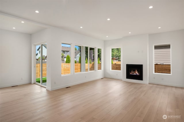 unfurnished living room featuring light hardwood / wood-style flooring