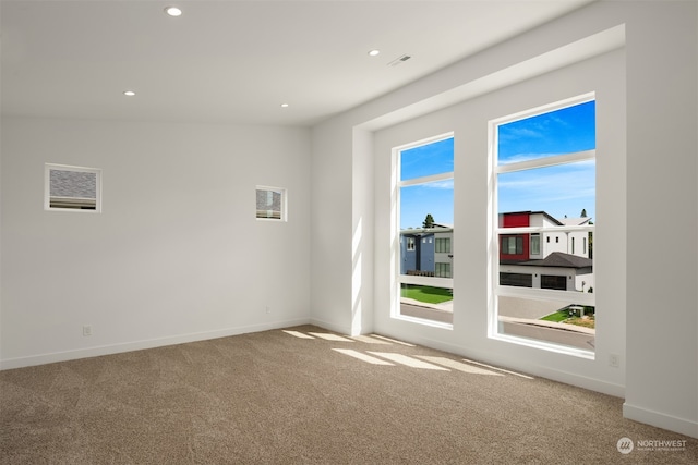 empty room with carpet flooring