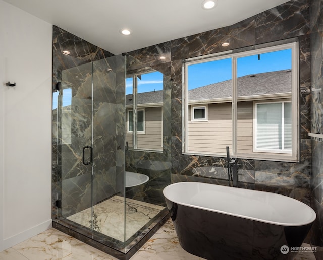 bathroom featuring plus walk in shower, tile walls, and tile patterned floors