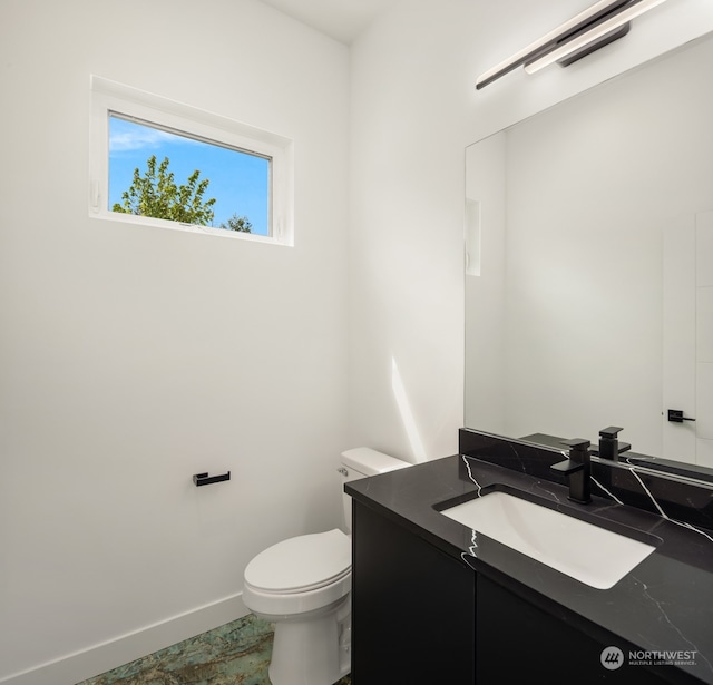 bathroom with tile patterned floors, toilet, and vanity